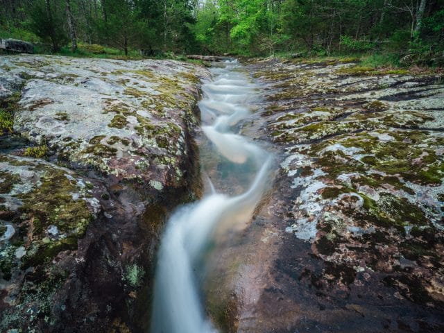 Water flowing through a channel eroded by Sweden Creek.